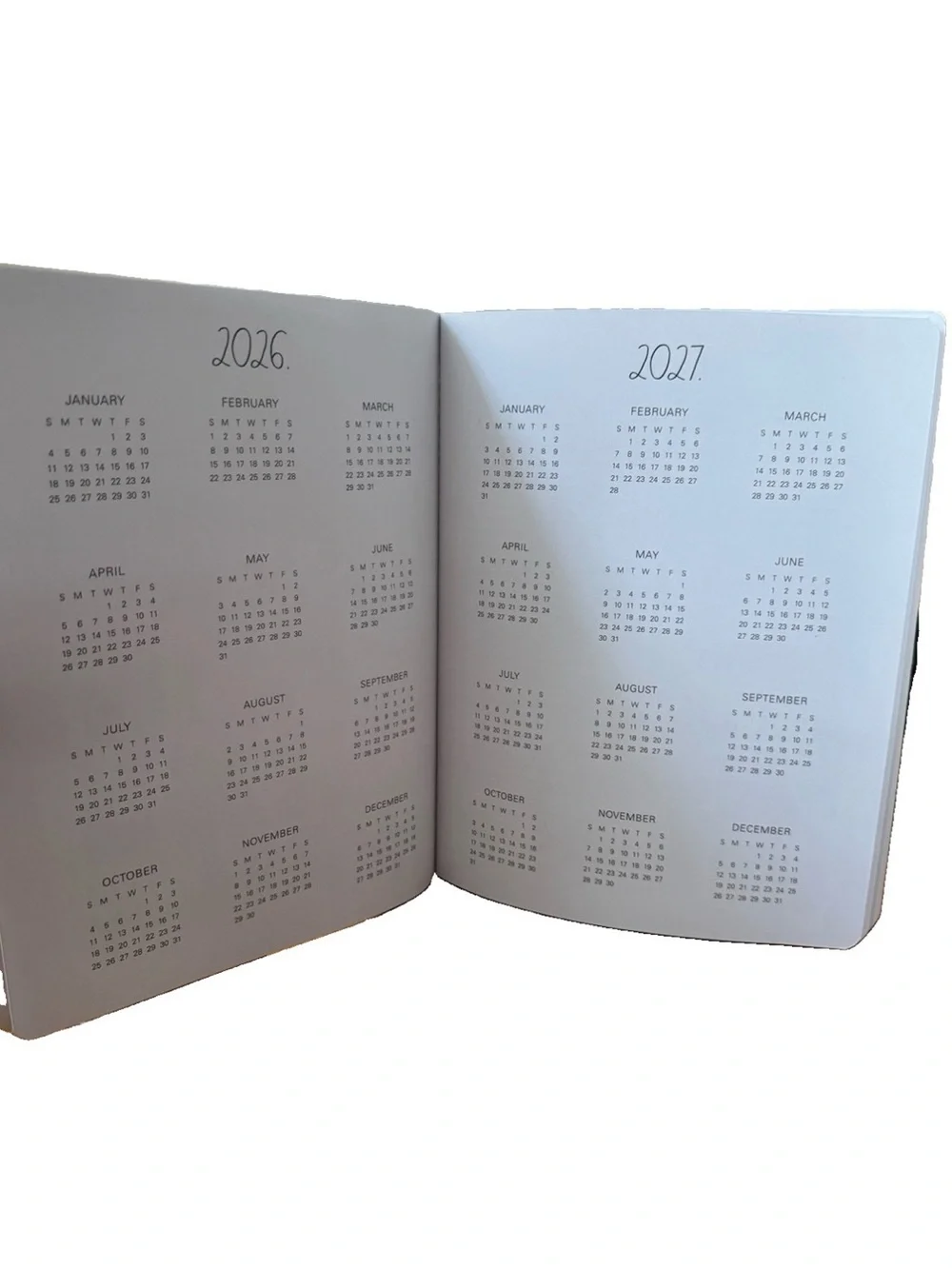 Rae Dunn 2027 PLANNER Soft Cover Spiral 17 months Planner  Ivory 9x7” Blue strip